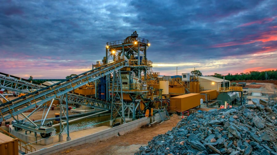 Heavy-duty mining operation with industrial equipment in use, representing environments where Verderflex® pumps handle slurry and abrasive fluids.